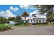 Fishhawk Aquatic Club featuring lush landscaping and a coastal-style architecture at 5710 Kingletsound Pl, Lithia, FL 33547