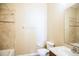 Bright bathroom featuring double sinks, tile floors, and a tub with shower at 5710 Kingletsound Pl, Lithia, FL 33547