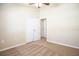 Light-filled bedroom featuring neutral carpet, ceiling fan, and a closet at 5710 Kingletsound Pl, Lithia, FL 33547