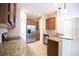 A kitchen featuring stainless steel appliances, granite countertops, and dark cabinets with an eat in breakfast bar at 5710 Kingletsound Pl, Lithia, FL 33547