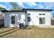 An exterior view of the home showcasing the modern architecture and a sliding glass door to the patio at 6475 29Th N Way, St Petersburg, FL 33702