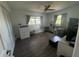 Bedroom featuring hardwood floors, two windows, closet, and ceiling fan at 6690 33Rd N Ave, St Petersburg, FL 33710