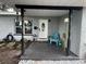 Inviting covered front porch with stone walkway and cozy seating area at 6690 33Rd N Ave, St Petersburg, FL 33710