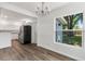An open floor plan reveals the updated kitchen with stainless steel refrigerator at 6690 33Rd N Ave, St Petersburg, FL 33710