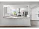 A newly renovated kitchen with stainless steel appliances and granite countertops at 6690 33Rd N Ave, St Petersburg, FL 33710