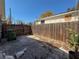 Private backyard with a tall wooden fence and stone pavers at 6708 S Faul St, Tampa, FL 33616