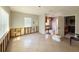 Spacious living room featuring tile flooring and exposed wall studs ready for renovation, offering customization potential at 6708 S Faul St, Tampa, FL 33616