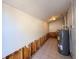 Utility room with water heater, tile floors, and exposed studs at 6708 S Faul St, Tampa, FL 33616