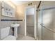 Cozy bathroom featuring a single sink and a tiled glass shower at 6901 298Th N Ave, Clearwater, FL 33761