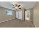 Bedroom featuring a ceiling fan and large closets at 6901 298Th N Ave, Clearwater, FL 33761