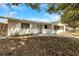 Welcoming single-story home with a brick accent, complemented by a beautifully maintained front yard at 6901 298Th N Ave, Clearwater, FL 33761