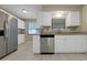 Kitchen featuring granite countertops, stainless steel appliances, and ample cabinet space at 6901 298Th N Ave, Clearwater, FL 33761