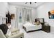 Comfortable bedroom with soft lighting, a cozy bed, and relaxing atmosphere at 7403 Edgemere Rd, Tampa, FL 33625
