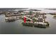 Aerial view of waterfront apartments showcasing a peninsula community on the water at 7910 Sun Island S Dr # 302, South Pasadena, FL 33707