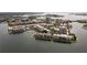 Aerial view of waterfront apartments showcasing a peninsula community on the water at 7910 Sun Island S Dr # 302, South Pasadena, FL 33707