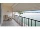 The outdoor balcony offers seating and a tranquil waterfront view at 7910 Sun Island S Dr # 302, South Pasadena, FL 33707