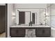 Modern bathroom features a double vanity, large mirror, and sleek fixtures for a luxurious feel at 8 Avonwood, Tampa, FL 33625