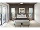 Cozy bedroom featuring a large window, neutral tones and soft textures create a relaxing atmosphere at 8 Avonwood, Tampa, FL 33625