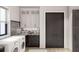 Well-equipped laundry room with modern washer, dryer and plenty of cabinet space at 8 Avonwood, Tampa, FL 33625