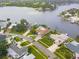 Stunning aerial view of waterfront homes with private docks and lush landscaping on a beautiful waterway at 995 Eden Isle Ne Dr, St Petersburg, FL 33704