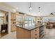 Spacious kitchen with granite countertops, stainless steel appliances, and water views at 995 Eden Isle Ne Dr, St Petersburg, FL 33704