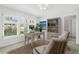 Bright office featuring white shutters, neutral decor, and built in bookshelf at 995 Eden Isle Ne Dr, St Petersburg, FL 33704