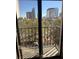 The balcony offers a view of city buildings, trees, and a sunny sky at 105 4Th Ne Ave # 501, St Petersburg, FL 33701