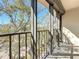 View from the balcony with metal railing, showcasing lush greenery and urban landscape at 105 4Th Ne Ave # 501, St Petersburg, FL 33701