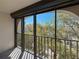 Private balcony featuring iron railings with views of trees and buildings at 105 4Th Ne Ave # 501, St Petersburg, FL 33701