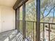 The balcony showcases a view of trees and buildings, framed by a metal railing at 105 4Th Ne Ave # 501, St Petersburg, FL 33701
