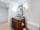 Bathroom features a granite countertop vanity with a mirror and updated fixtures at 105 4Th Ne Ave # 501, St Petersburg, FL 33701