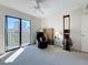 Bedroom features a ceiling fan, a city view from balcony, and neutral carpeting at 105 4Th Ne Ave # 501, St Petersburg, FL 33701