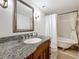 Elegant bathroom with a clawfoot tub and granite vanity at 105 4Th Ne Ave # 501, St Petersburg, FL 33701