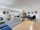 Bright living room with hardwood floors, neutral decor, and a balcony access at 105 4Th Ne Ave # 501, St Petersburg, FL 33701