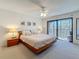 Spacious main bedroom with a ceiling fan and balcony access at 105 4Th Ne Ave # 501, St Petersburg, FL 33701