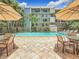 Inviting community pool area with tables and umbrellas at 105 4Th Ne Ave # 501, St Petersburg, FL 33701