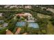 Community aerial view highlighting tennis courts, pickleball courts, and swimming pool area at 11321 Copley Ct, Spring Hill, FL 34609