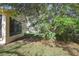 A view of the exterior of the home and green grass at 11321 Copley Ct, Spring Hill, FL 34609