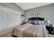 Comfortable bedroom featuring neutral tones, a plush bed, and ample closet space at 11321 Copley Ct, Spring Hill, FL 34609
