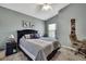 Comfortable bedroom featuring a patterned bedspread, stylish decor, and a cozy atmosphere at 11321 Copley Ct, Spring Hill, FL 34609