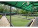 Bocce ball courts and shaded seating creating a welcoming community gathering spot at 11321 Copley Ct, Spring Hill, FL 34609