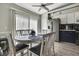 Bright dining area with a modern table set and natural light from large window at 11321 Copley Ct, Spring Hill, FL 34609