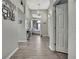 Open hallway leading to a bedroom, with high ceilings and neutral tones at 11321 Copley Ct, Spring Hill, FL 34609