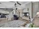 Cozy living room opens to the kitchen and features a ceiling fan and comfortable seating at 11321 Copley Ct, Spring Hill, FL 34609