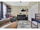 Cozy living room featuring comfortable seating, a TV, and closet at 11321 Copley Ct, Spring Hill, FL 34609