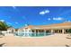 Sparkling community pool with a variety of seating options and manicured landscaping at 11321 Copley Ct, Spring Hill, FL 34609