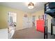 Cozy bedroom features loft bed, colorful dresser and adjacent rooms visible from the door way at 13103 Wildflower Meadow Dr, Riverview, FL 33579