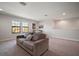 Spacious bonus room featuring neutral walls, carpet flooring, and natural light from two windows at 13103 Wildflower Meadow Dr, Riverview, FL 33579