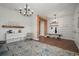 Entry with modern chandelier, wood-look flooring, and hooks and shoe storage at 13103 Wildflower Meadow Dr, Riverview, FL 33579