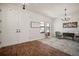 Bright foyer features modern chandelier, wood-look flooring, and crisp, white shiplap accent wall at 13103 Wildflower Meadow Dr, Riverview, FL 33579